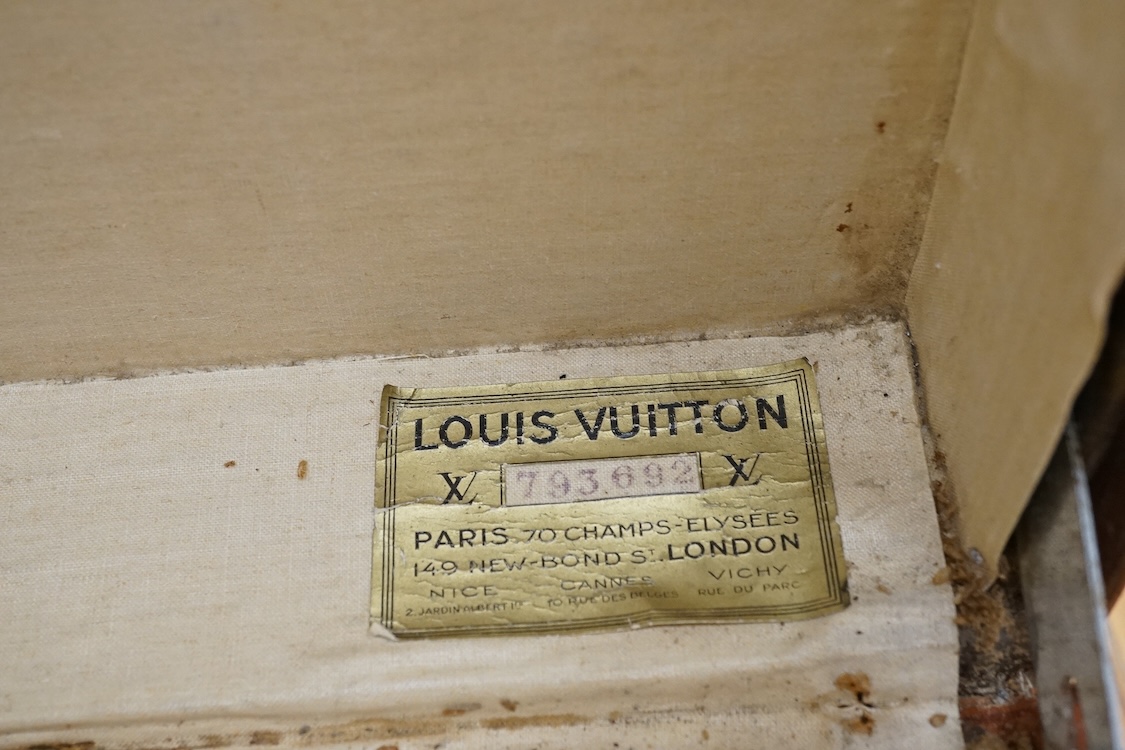 A vintage Louis Vuitton monogram suitcase with two original keys, numbered 793692 to the linen covered interior, height 22cm, width 76cm, depth 46cm